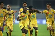 Kerala Blasters celebrate Courage Pekuson's (second from right) goal against Bengaluru FC